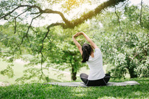young woman stretching outdoors