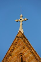 cross at the peak of a church
