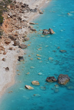 aerial view over turquoise blue sea 