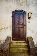 steps to a wooden door 