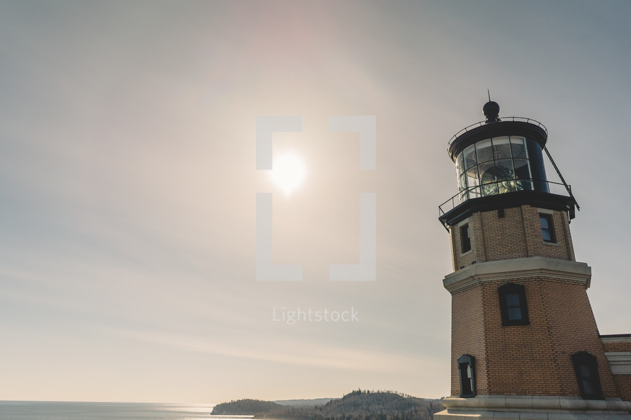 a lighthouse at daybreak 