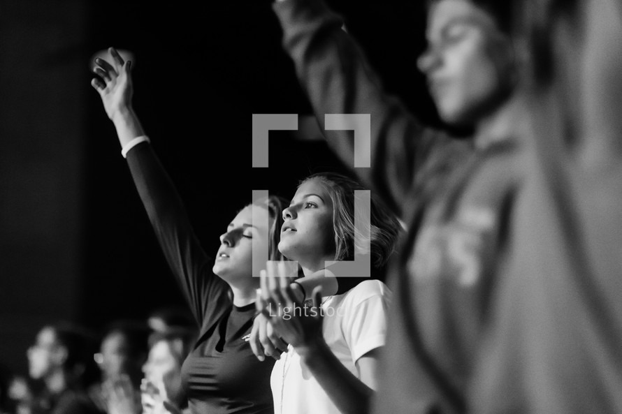 youth praising God at a concert 