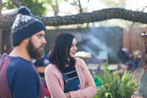 people talking at an outdoor gathering 