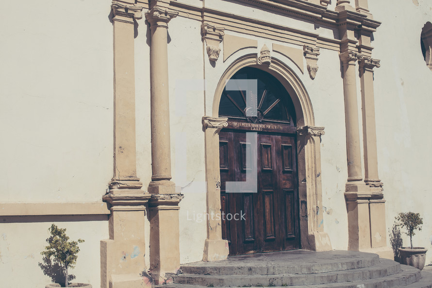 wood front doors to a church 