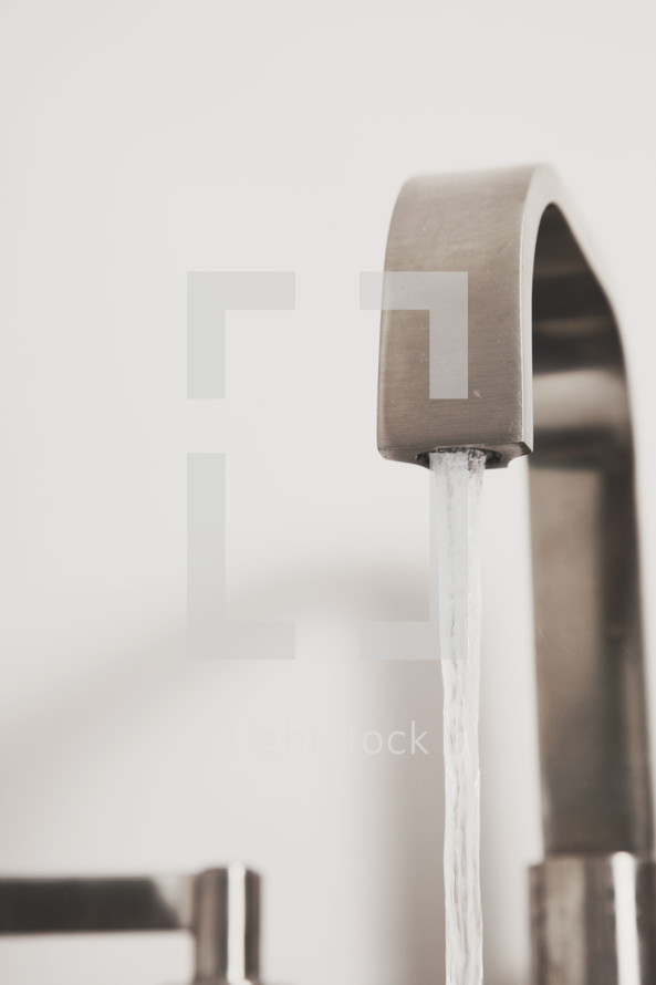Water running from a faucet.