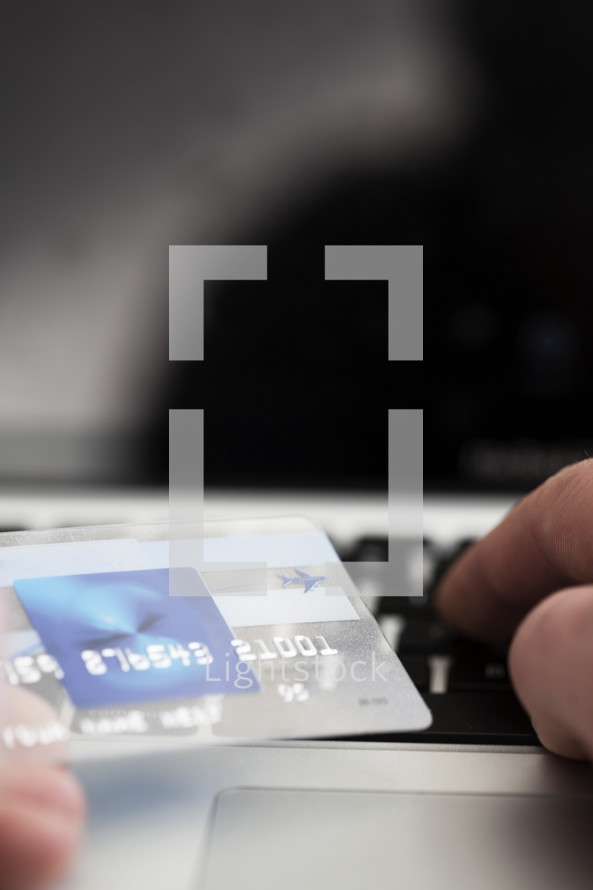 person entering credit card information online. 