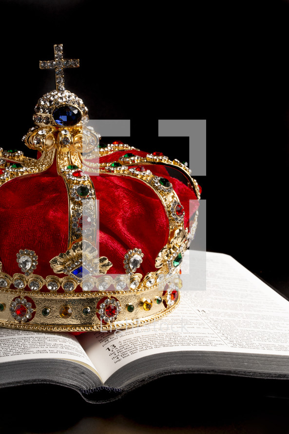 Kings Coronation Crown and a Bible on a Black Background
