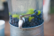 blueberries and limes in a drink 