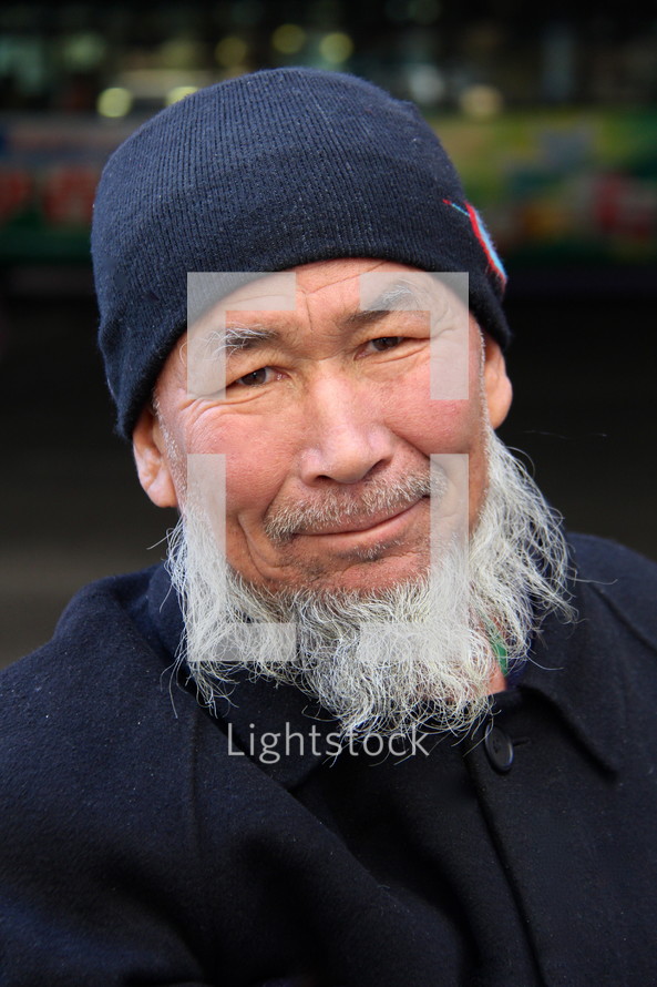 Muslim man with a white beard 