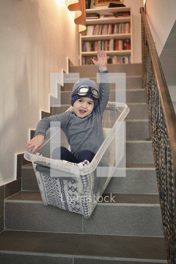 kids having fun on stairs in a bucket 