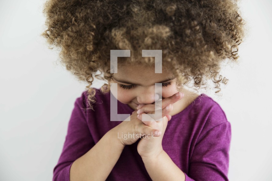 little girl child in prayer.