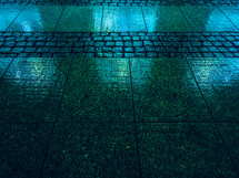 wet sidewalk at night 