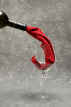 Abstract Red Wine From Cloth Pouring Into A Glass From Bottle
