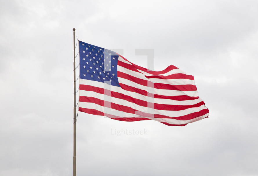 American Flag with a  Cloudy Sky