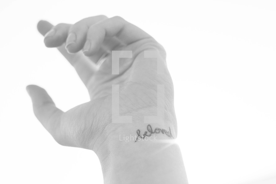 beloved tattoo on a wrist