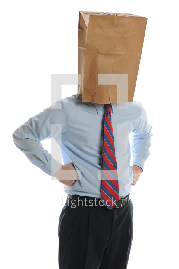 businessman wearing a paper bag on his head 