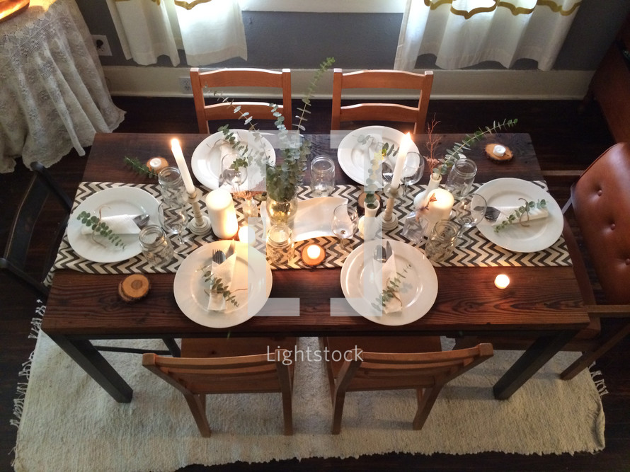 View from above of a dining table set to serve six.