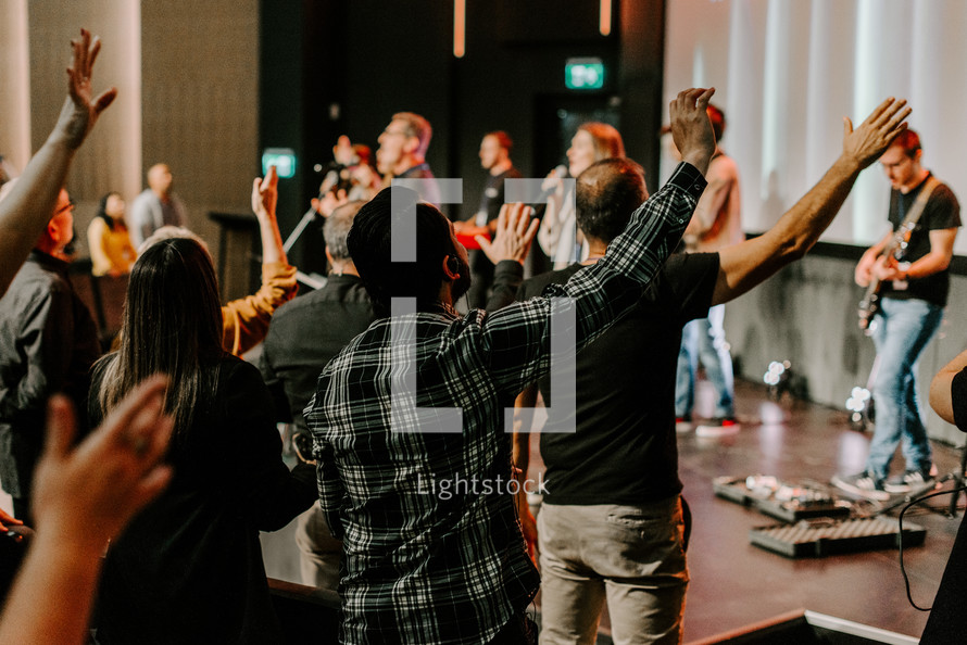 Hands raised in worship at church