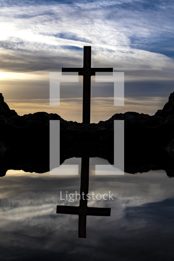 tide pool and silhouette of a cross