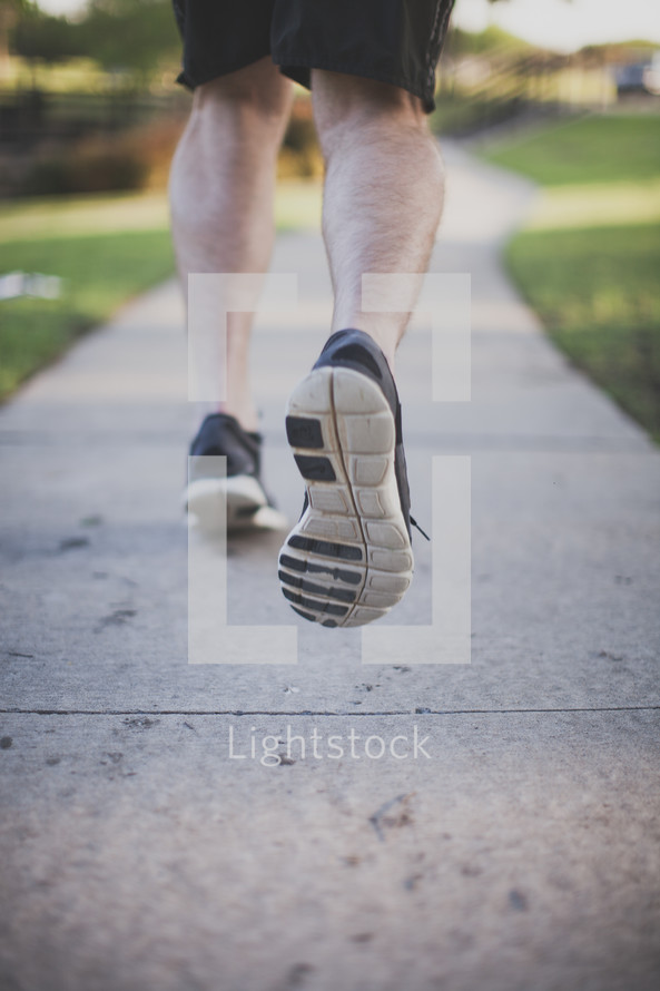 Runner on the sidewalk.