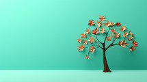 Origami tree on a fall mint background.
