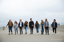 group of young people walking 