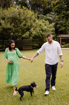 expecting couple and dog 