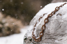 rusty chain in snow 