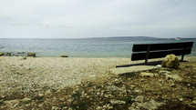 park bench facing the sea 