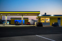 a gas station at night 