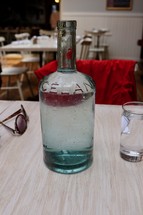 glass bottle of water on a table 