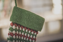 A red and green stocking hanging