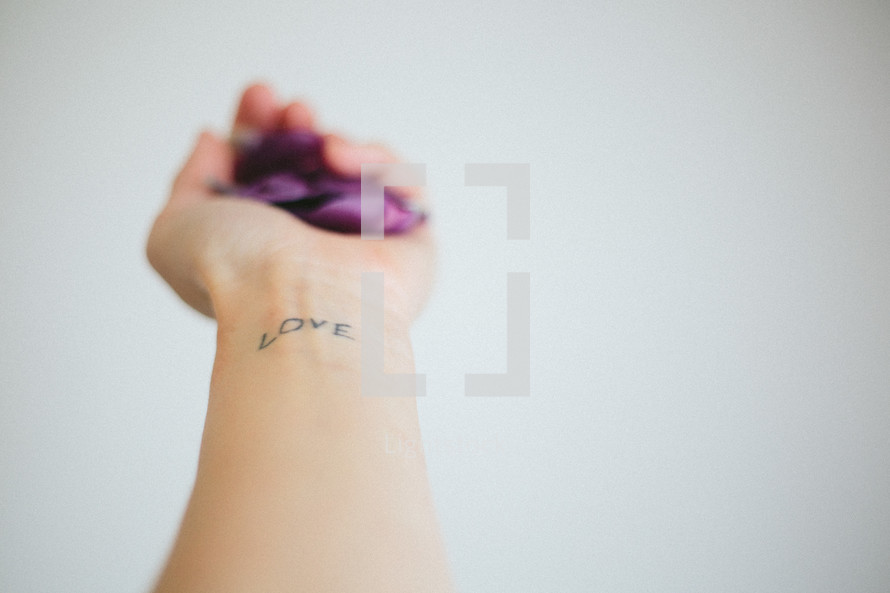 love tattoo on a wrist 