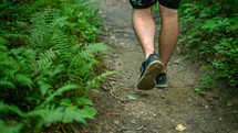 a man hiking on a trail 