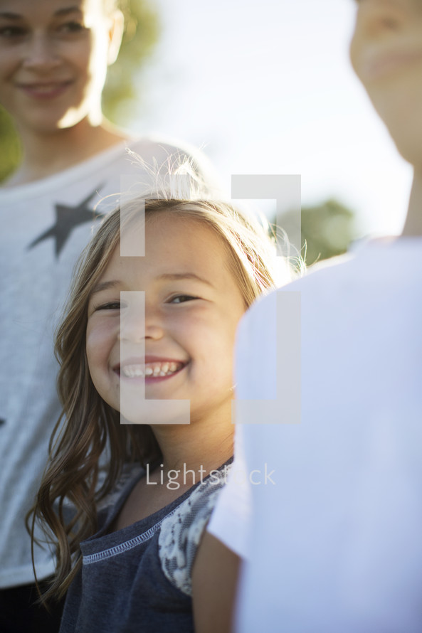 portrait of smiling children outdoors 