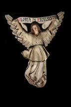 Angel figurine holding a banner reading Gloria in Excelsis