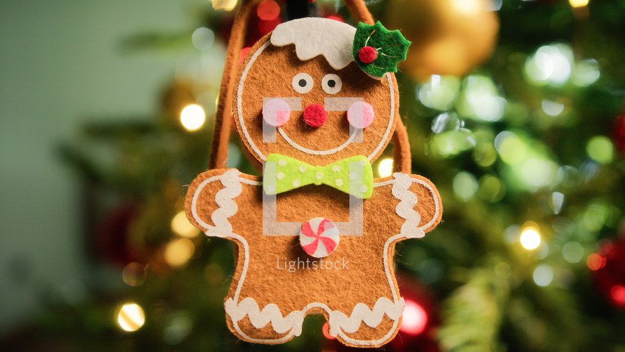 Gingerbread man decoration hanging on a tree