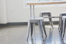 metal stools under a table 