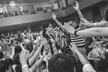 raised hands in worship at a worship service 