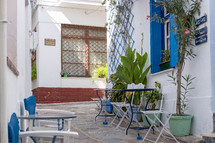 outdoor seating and blue shutters 