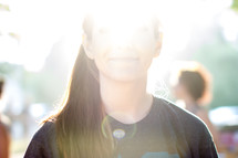 sun glare on a teen girls face