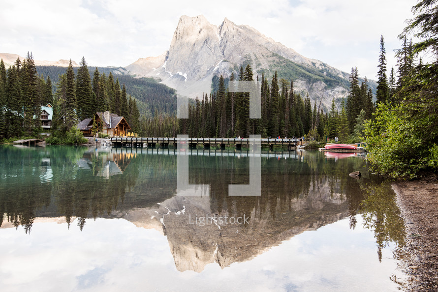 lake, lodge, and mountain peak 