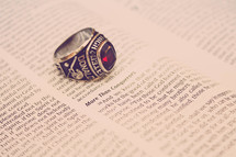 high school ring on the pages of a Bible