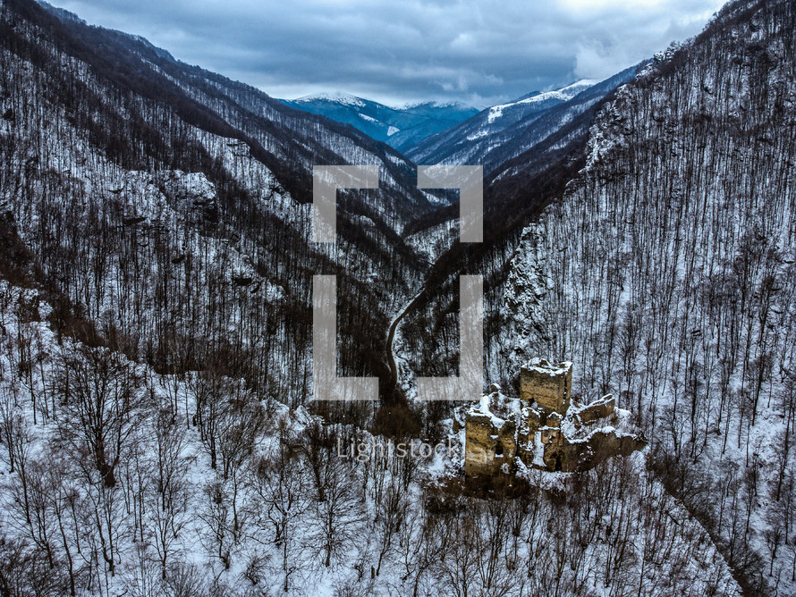 ruins in a snowy valley 