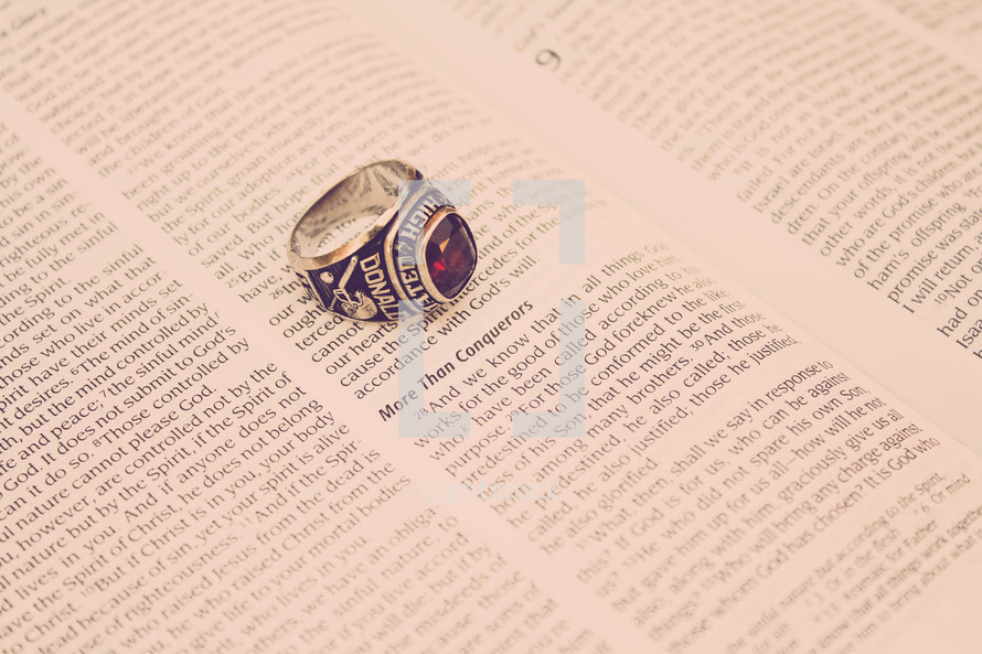 high school ring on the pages of a Bible