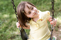girl child on a swing 