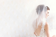 A bride wearing her wedding veil. 