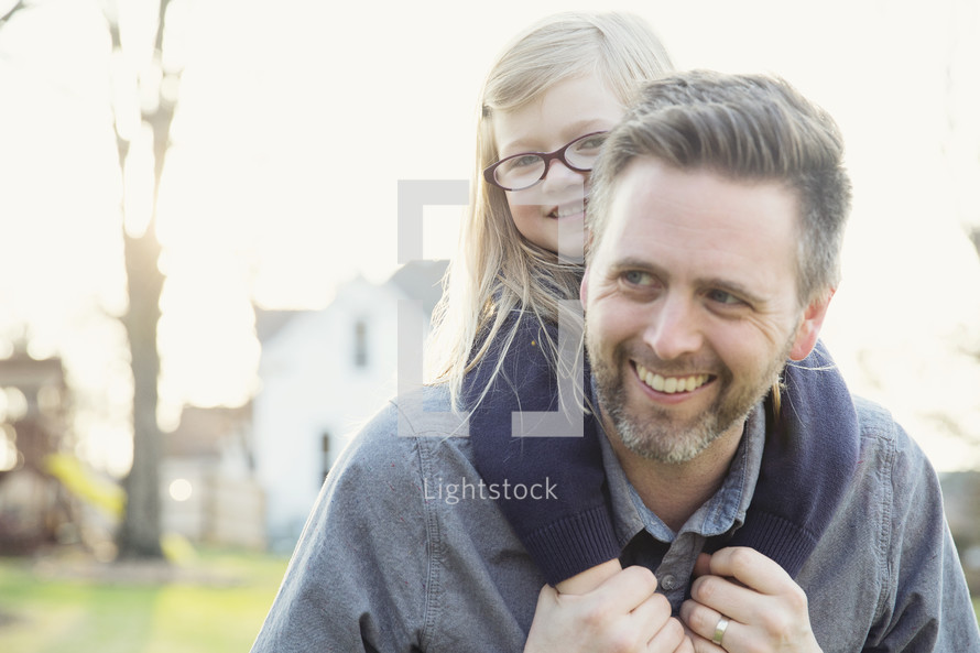 father and daughter together outdoors 