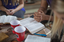 praying and reading Bibles in a small group Bible study