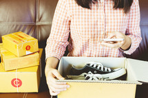 a woman mailing packages from home for her home business 